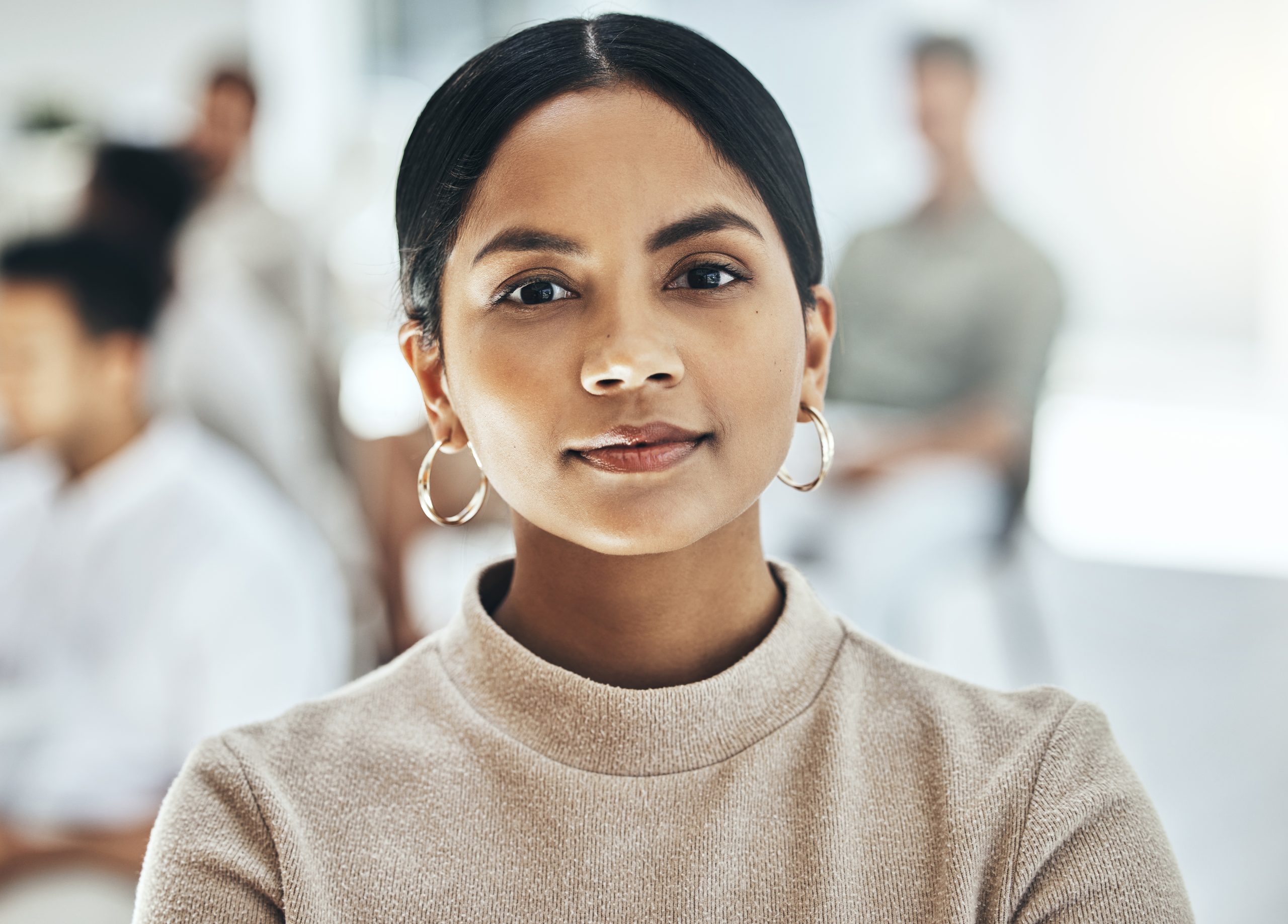 I got my game face on. Shot of a businesswoman smiling at a business meeting in a modern office